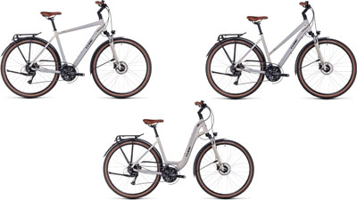 Three Cube Touring Pro bikes side by side: one with a diamond frame, one with a trapezoidal frame, and one with a low step-through frame.