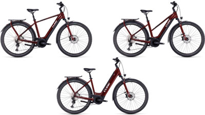 On display are three dark red Cube Touring Hybrid ONE e-bikes, each with a diamond frame, a trapezoidal frame, and a low step-through frame.